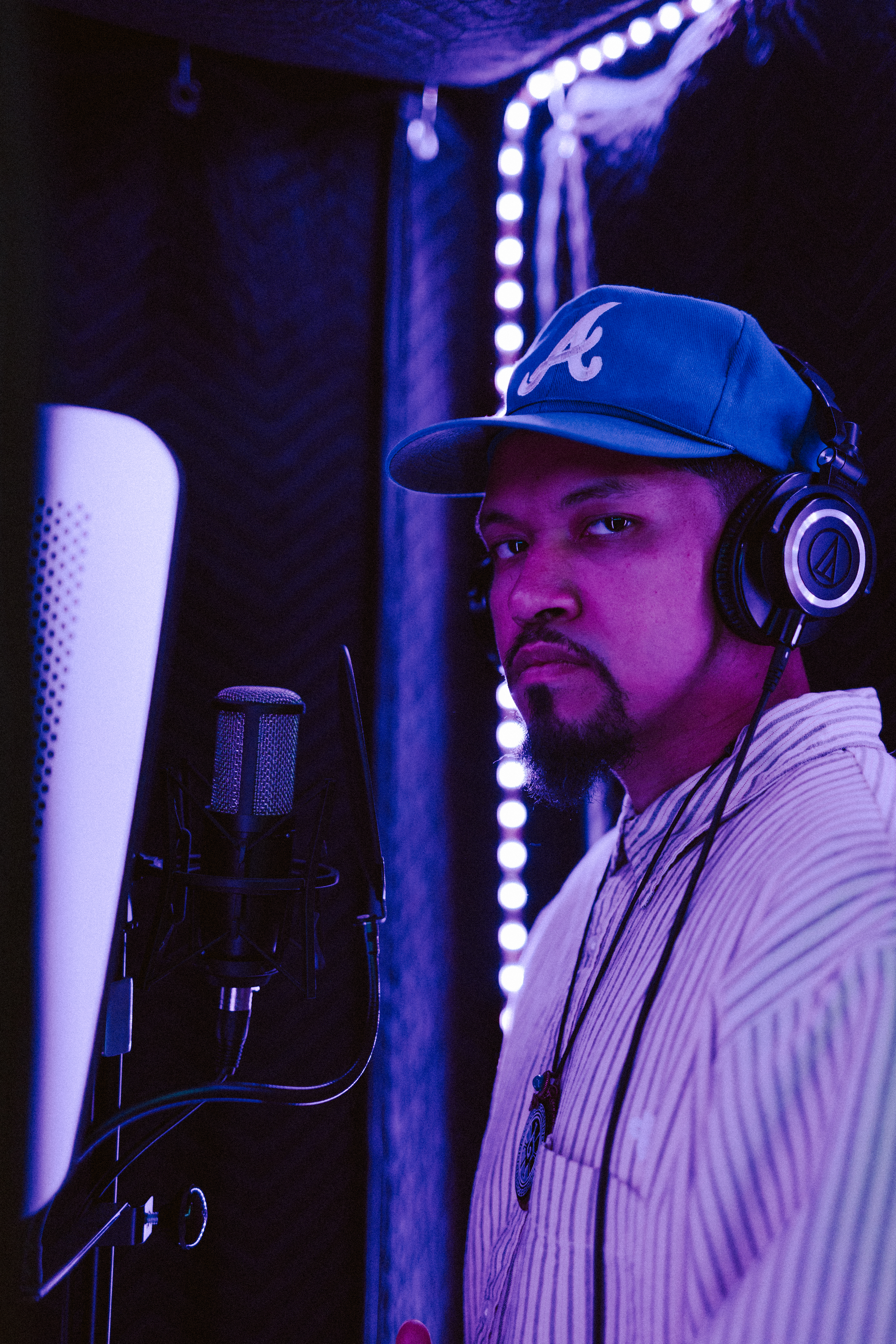 Artist in the vocal booth during a Dojo Studios session
