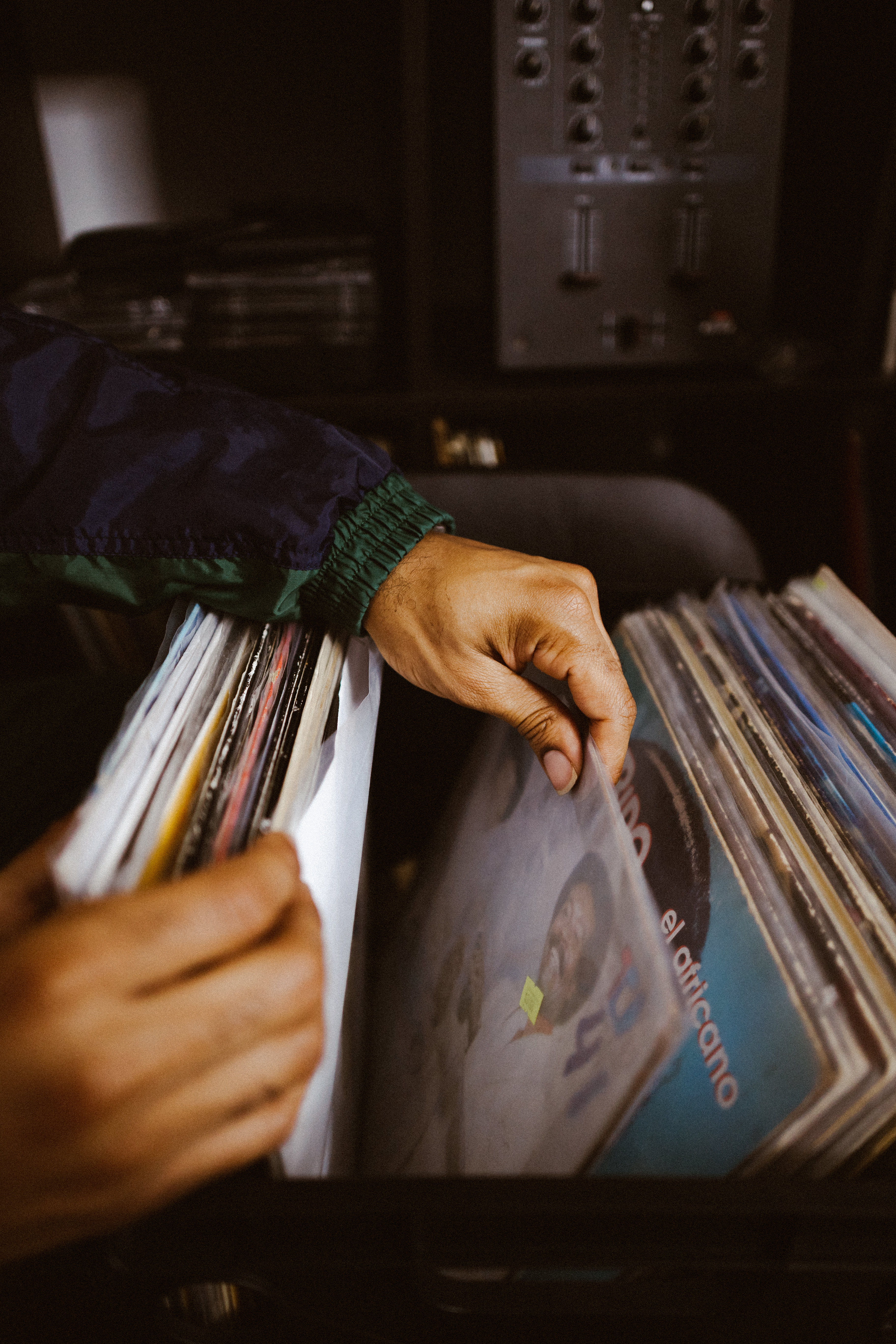 Artist browsing vinyl records inside Dojo Studios