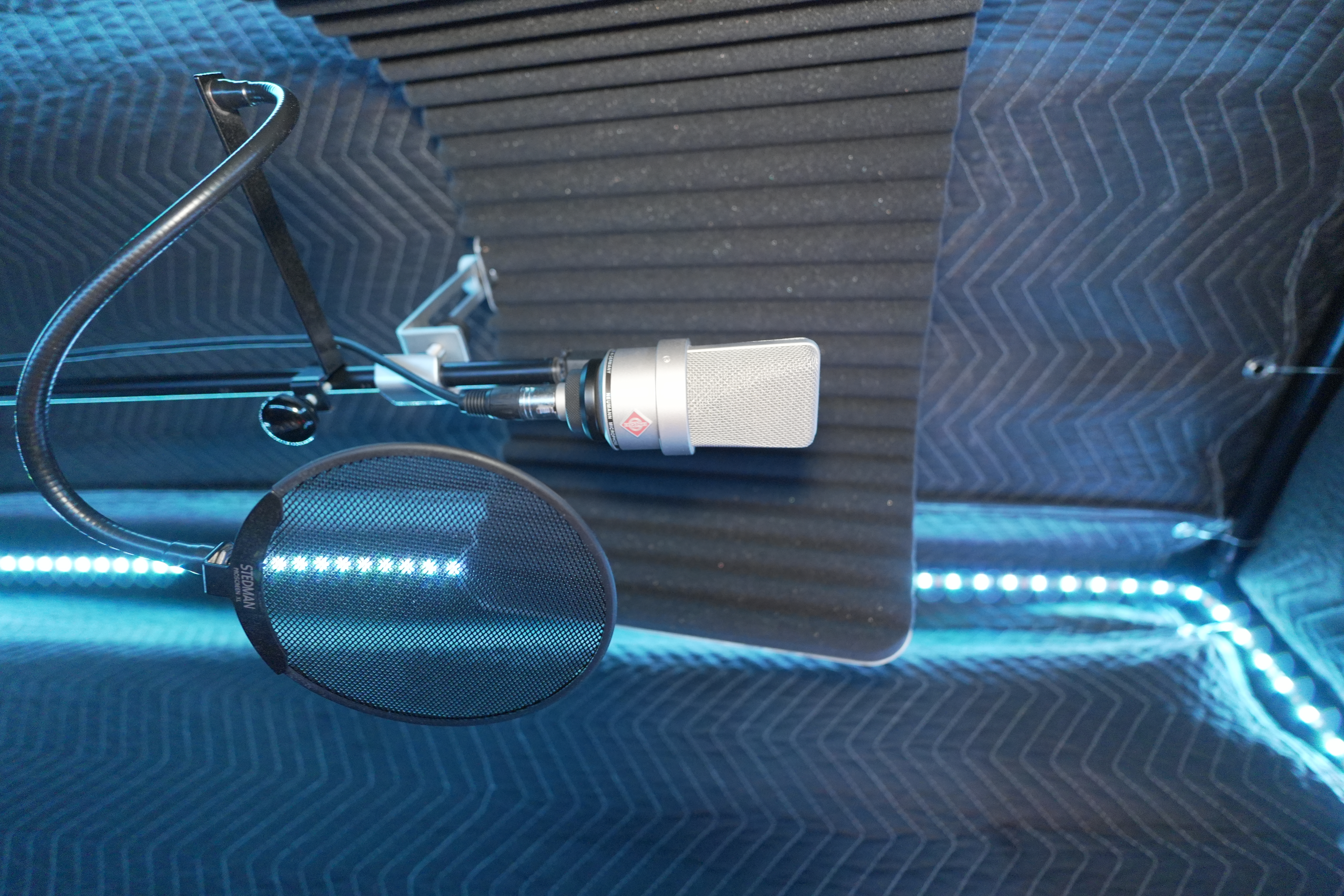 Studio microphone and pop filter inside the Dojo Studios vocal booth
